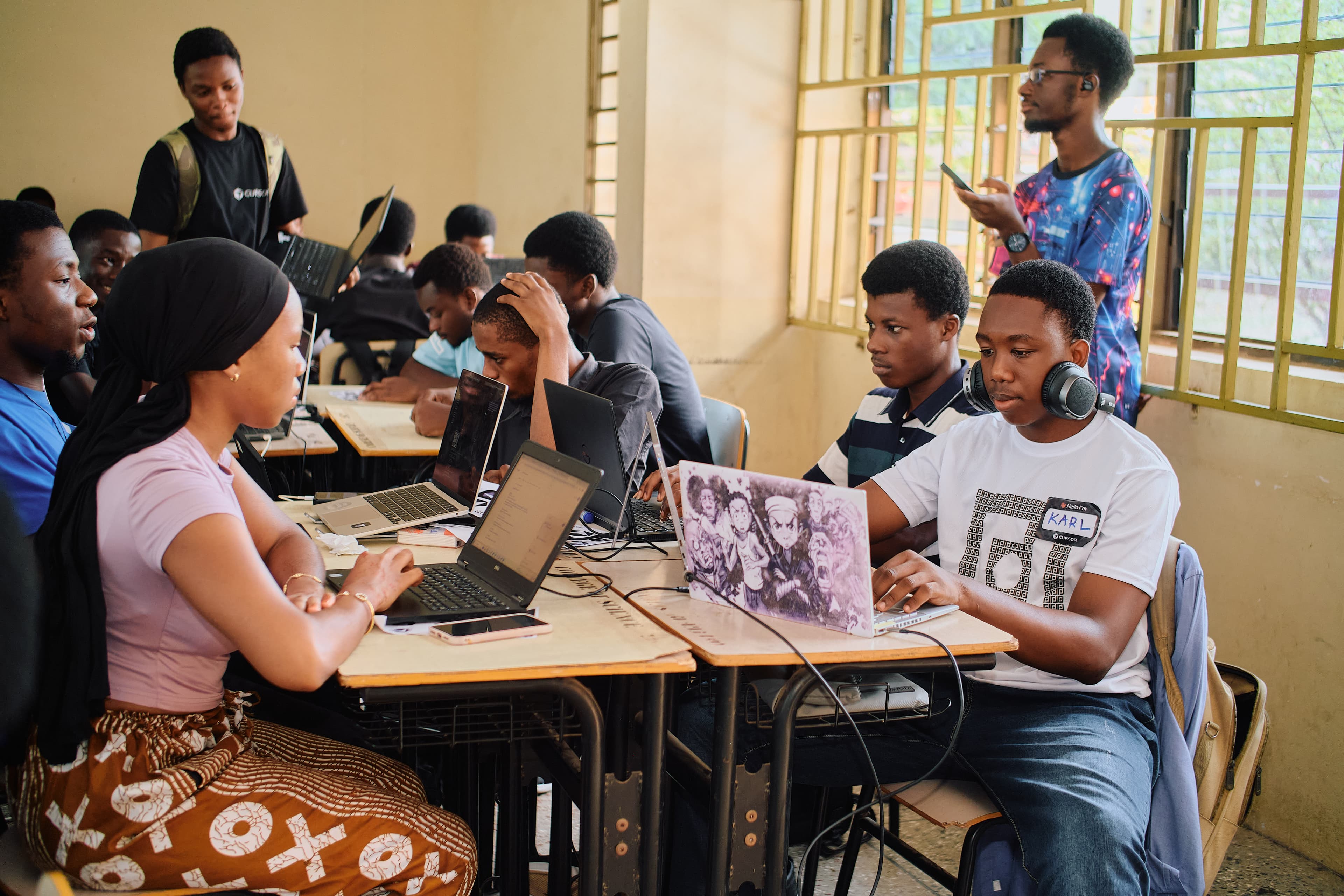 Builders coding at a Cursor Ghana hackathon